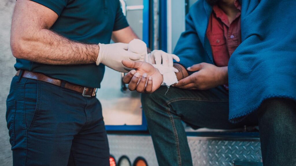 Paramedic helping injured person